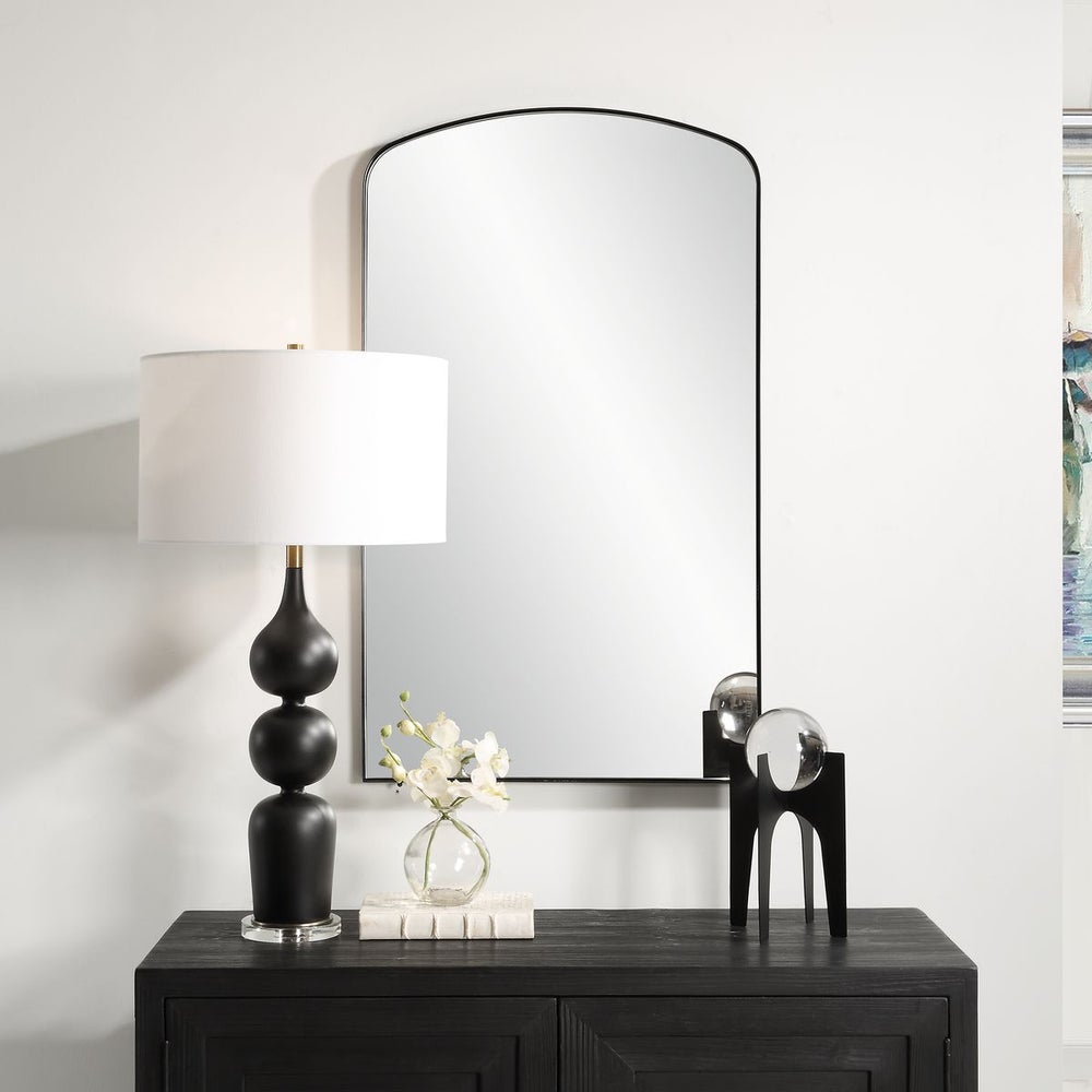 Black Arched Mirror in Bedroom.