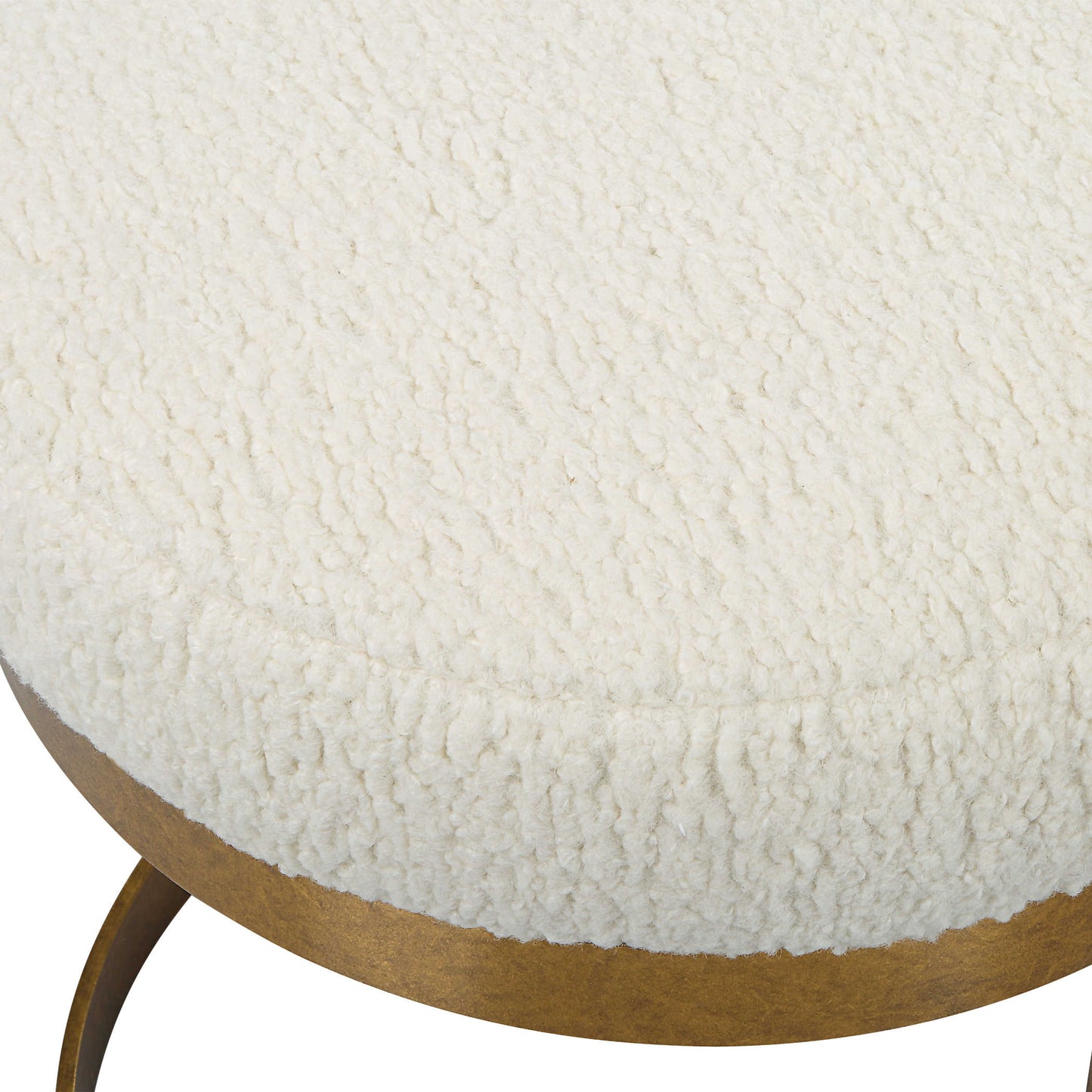 Close-up photo of a gold bench with faux upholstery
