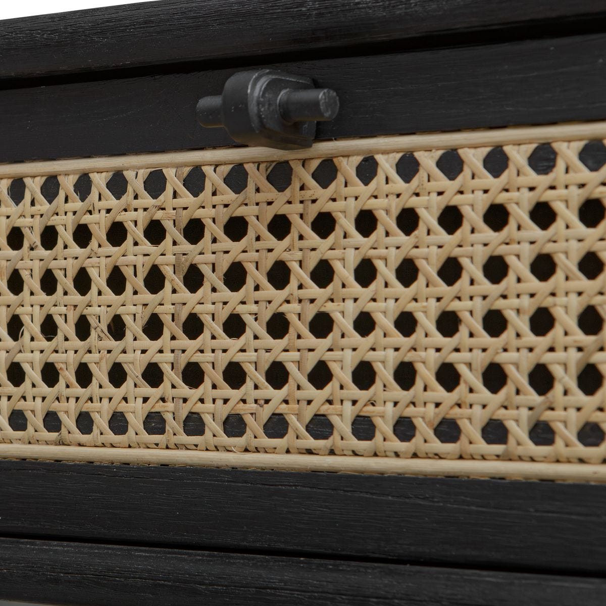 Close-up of a woven pattern on a wooden surface