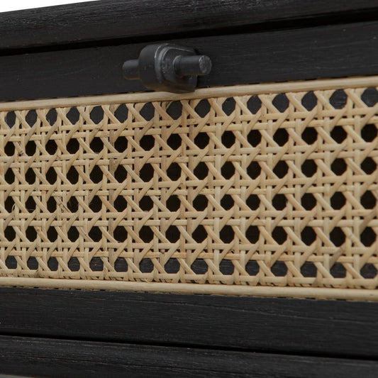 Black side table with woven drawer in a living room setting