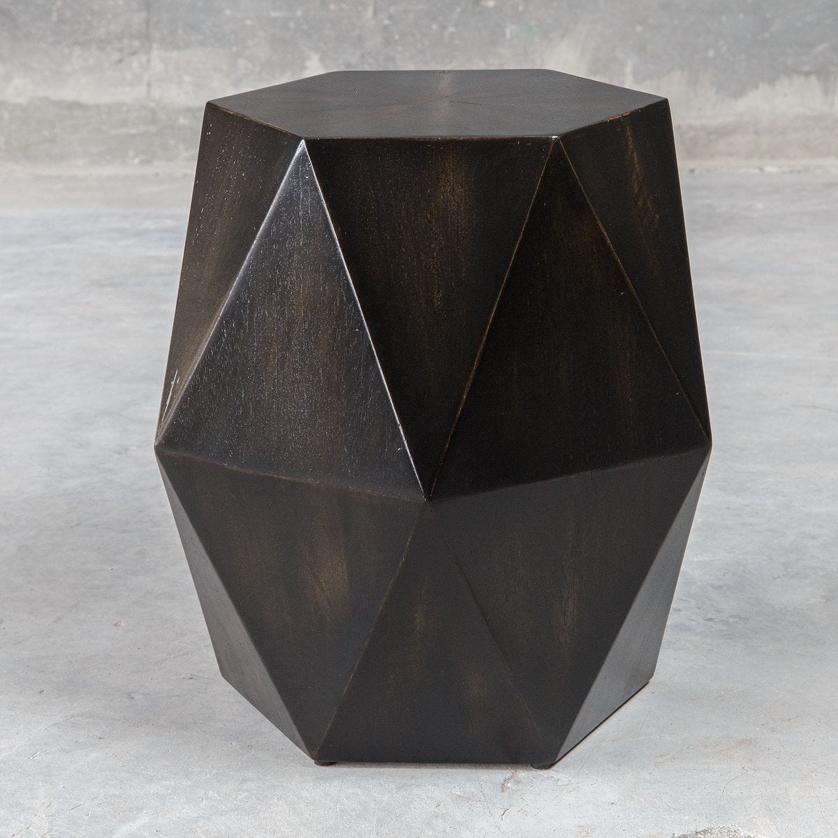 Geometric dark brown side table on a light gray background