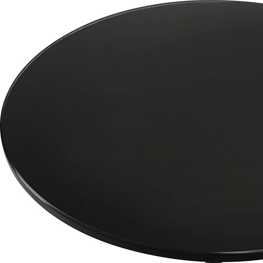 Beige armchair in a room with a round mirror and small table.