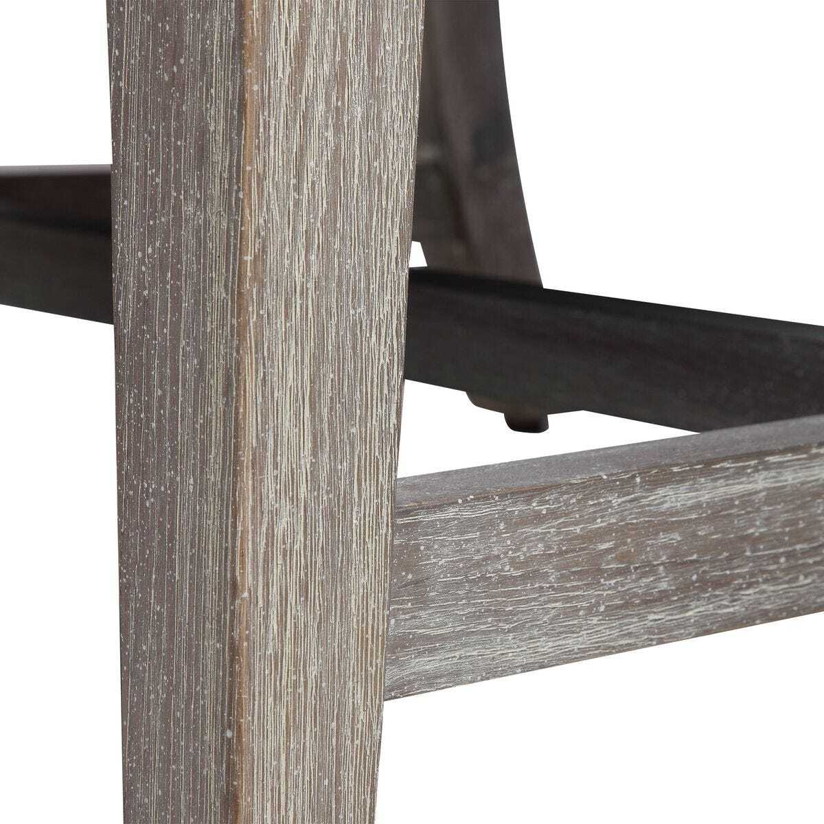 Close-up of a wooden chair frame with a white background