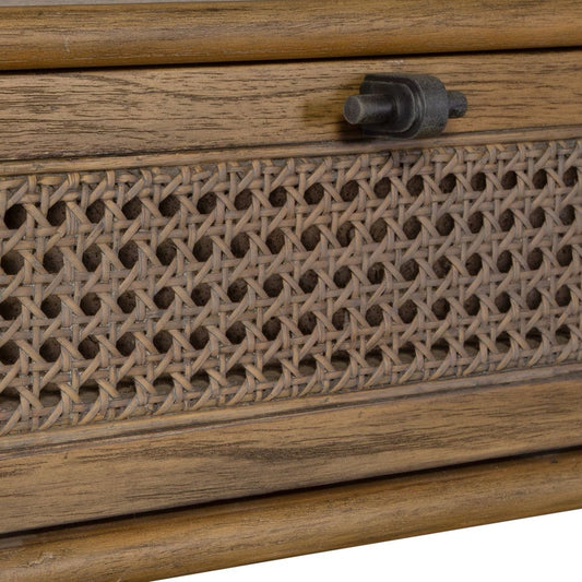 Coastal console with storage drawers and a piece of art and a couple of containers.