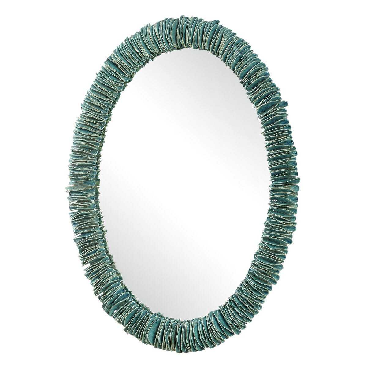 Oval mirror with a textured teal frame on a white background