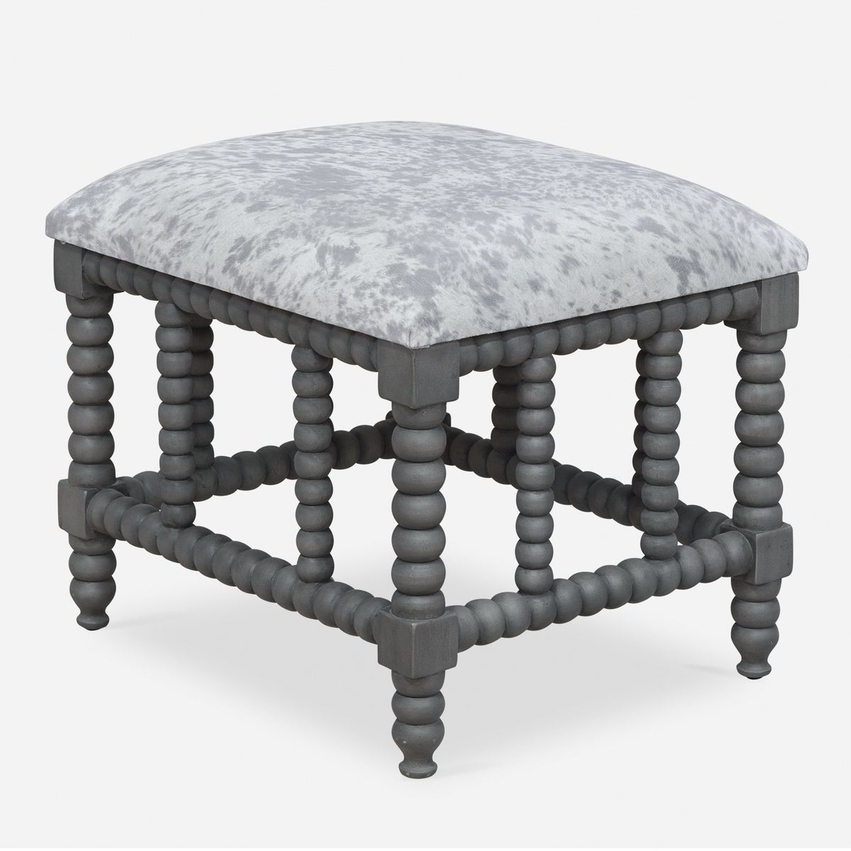 Fake cowhide farmhouse style living room pouf.
