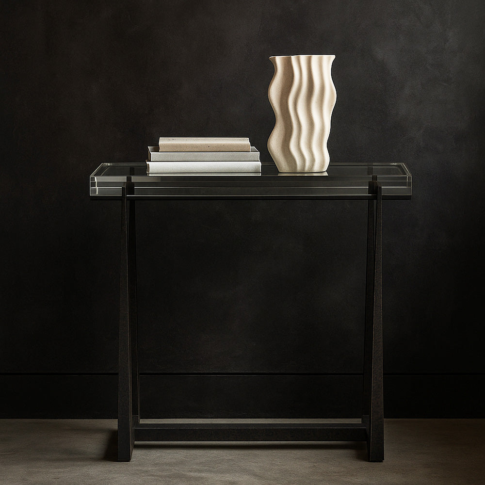 Crystal side table in a dark entry.