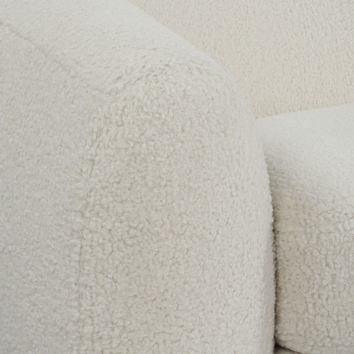 Close-up of textured ivory fabric with a soft, plush finish.
