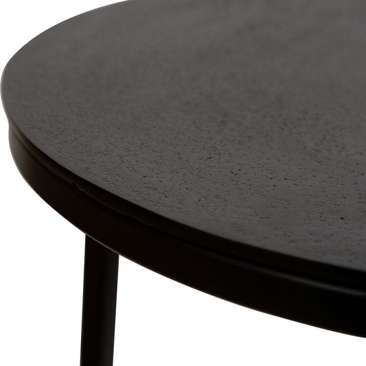 Modern gray chair with a side table in a room setting