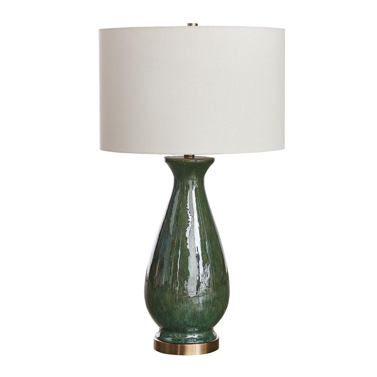 Green ceramic table lamp with a white shade on a white background