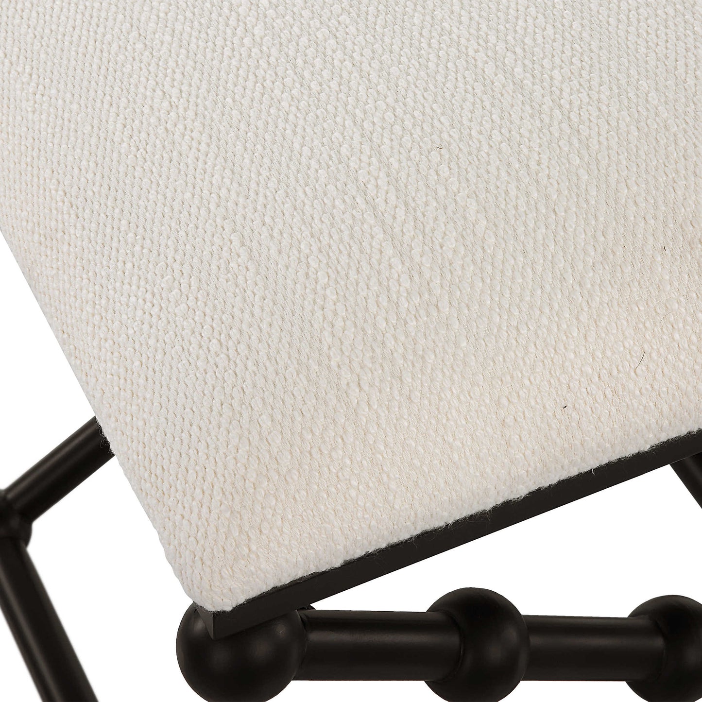 Polyester fabric of metal seat with white cushion.