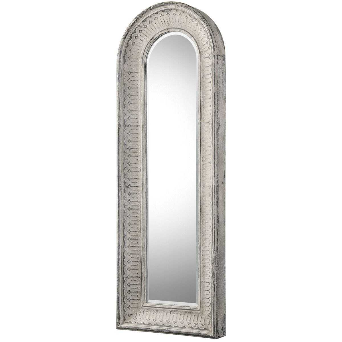 Arched mirror with decorative silver frame on a white background