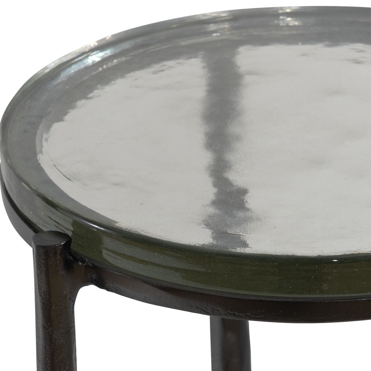 Round glass table with metal frame on a white background