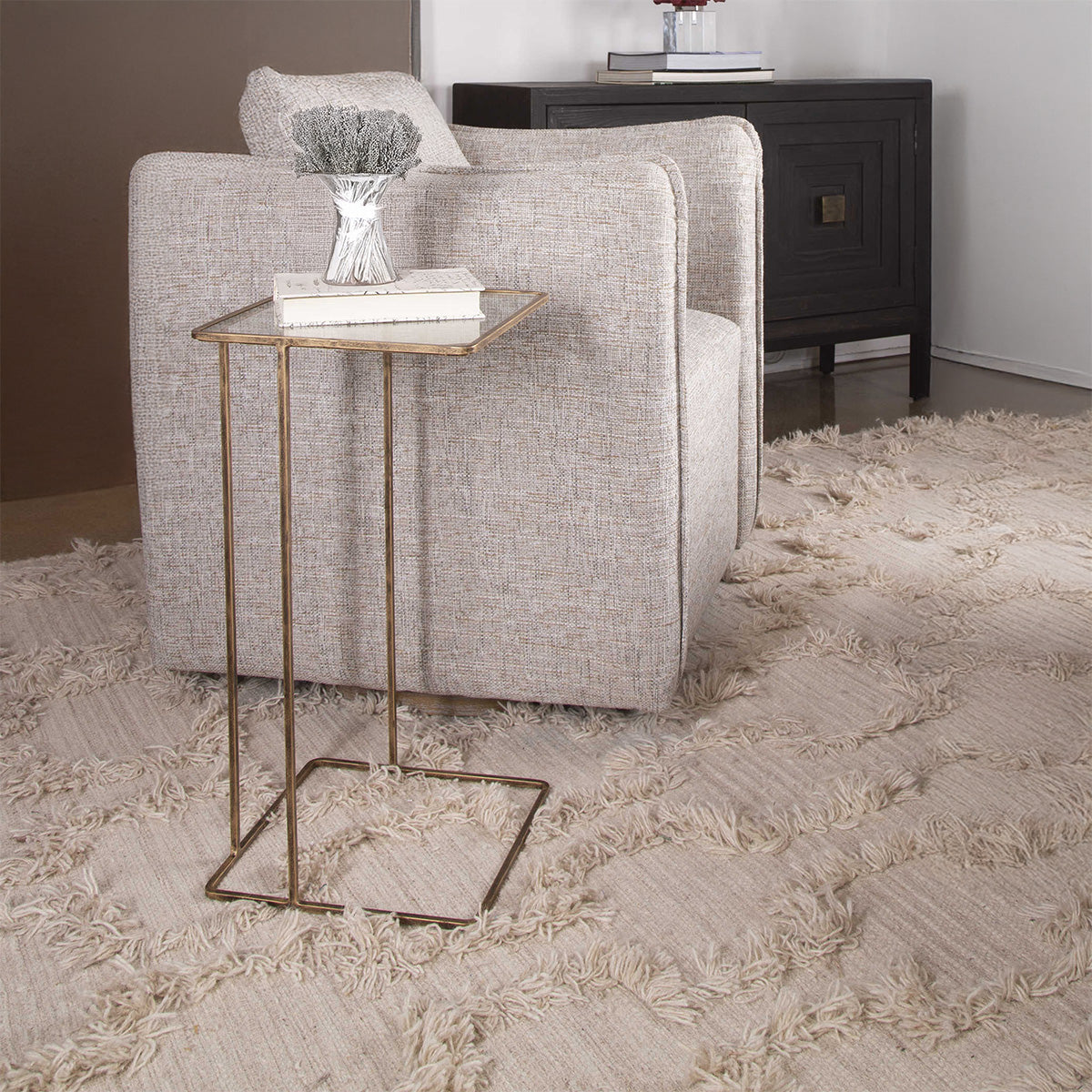 Gold glass side table in living room.