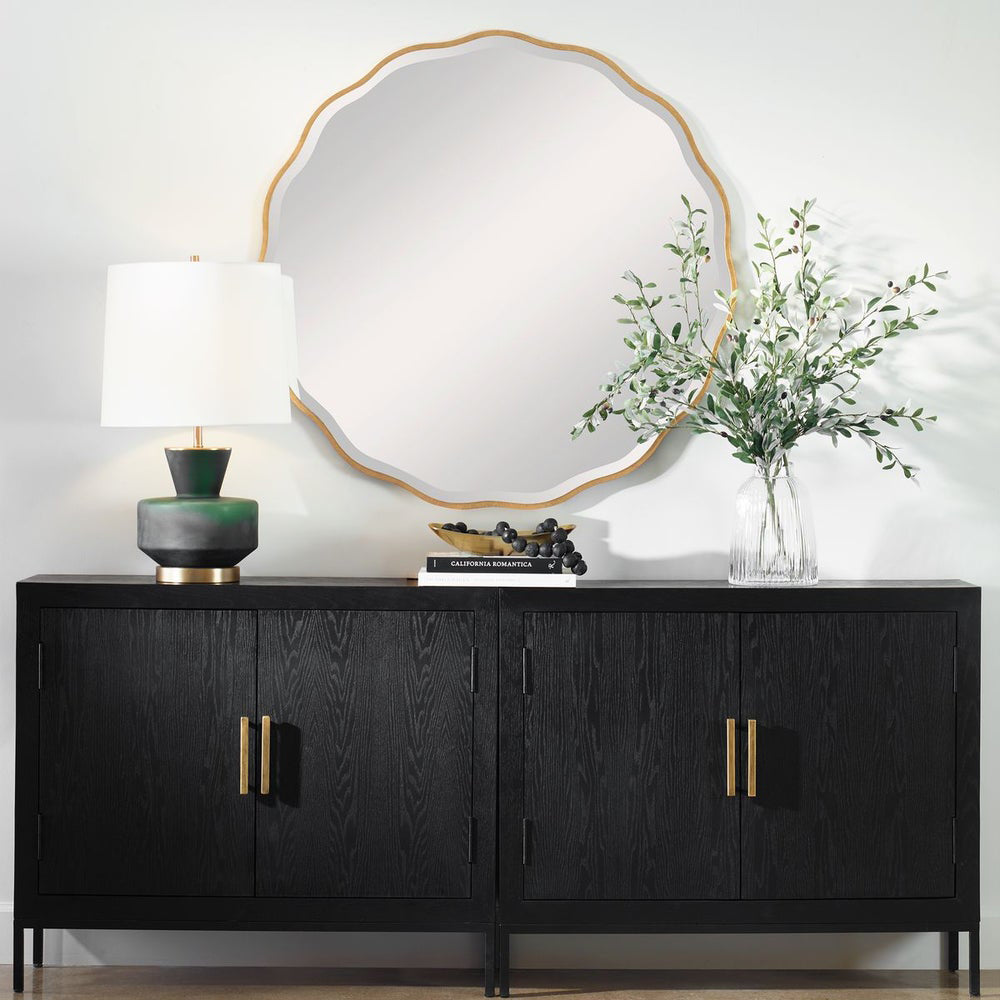 Gold Scalloped Mirror above Black Console.