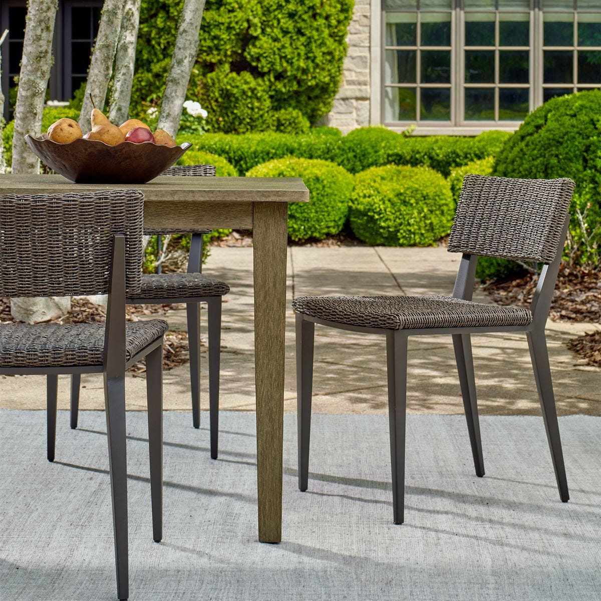 Gray Wicker Dining Chair on Patio.