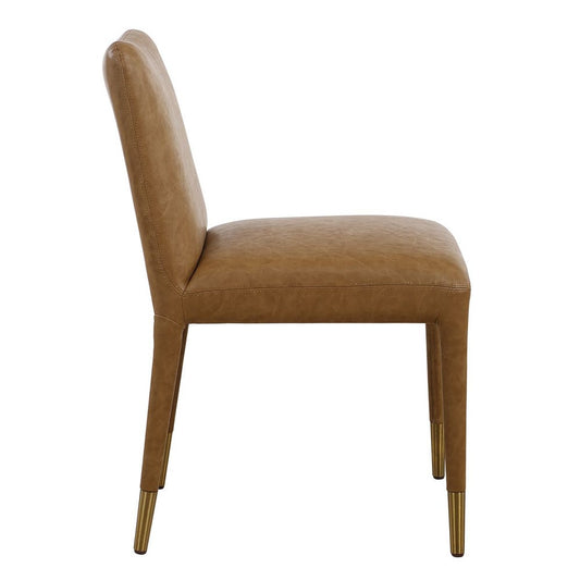 Stylish and contemporary camel faux leather dining chair with brushed brass ferrules.
