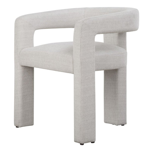 Sculptural dining chair next to a drink table.