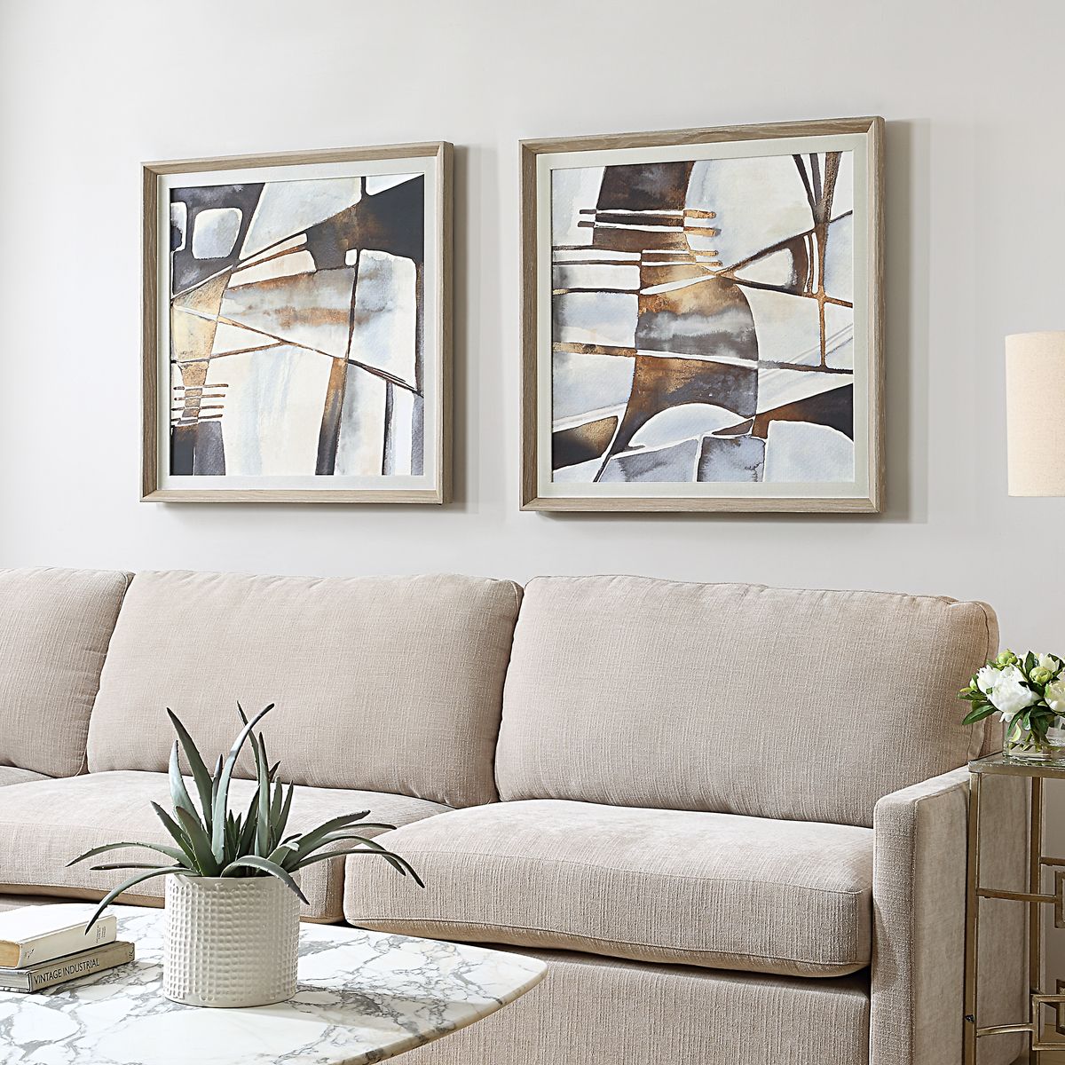 Looking for versatile artwork that complements any style? This stunning set of two framed abstract prints is the perfect solution. The organic shapes and sophisticated color palette of neutral gray, black, and warm chestnut blend seamlessly with both modern and traditional décor. The lightly whitewashed pine frames and off-white linen liners add a touch of rustic charm, creating a look that is both contemporary and timeless. Hang these prints as a pair for a cohesive statement, or separately to add a touch