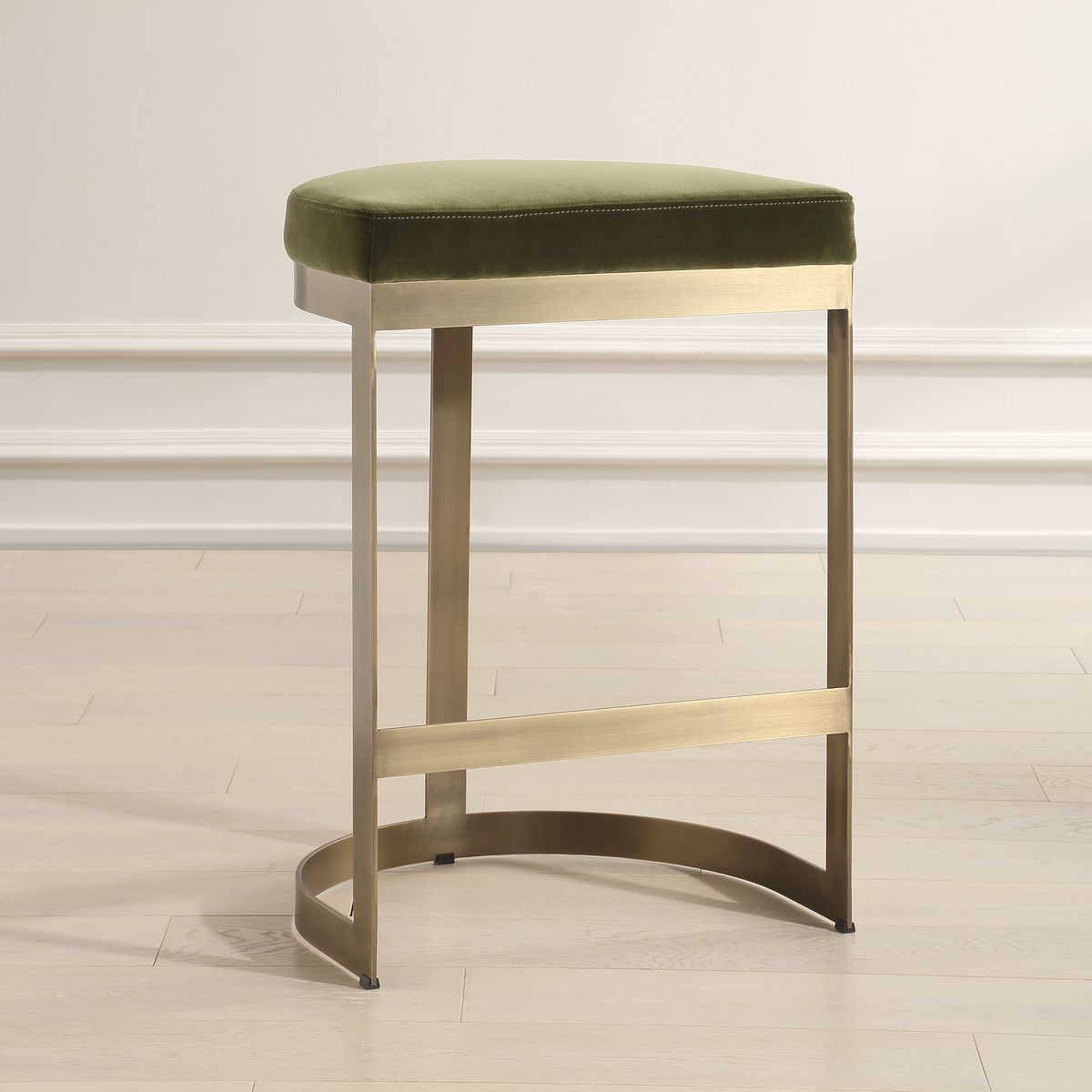 A Brushed Brass Counter Stool with a Moss Green Velvet Seat. Hand Forged Iron Base