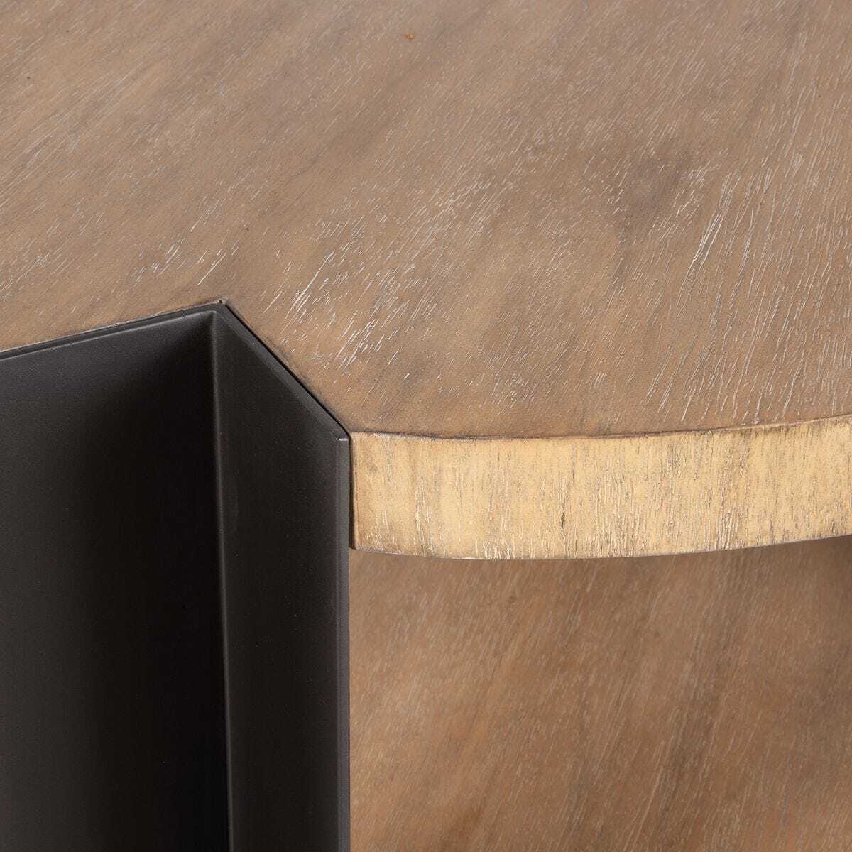 Close-up of a wooden surface with a black corner piece.