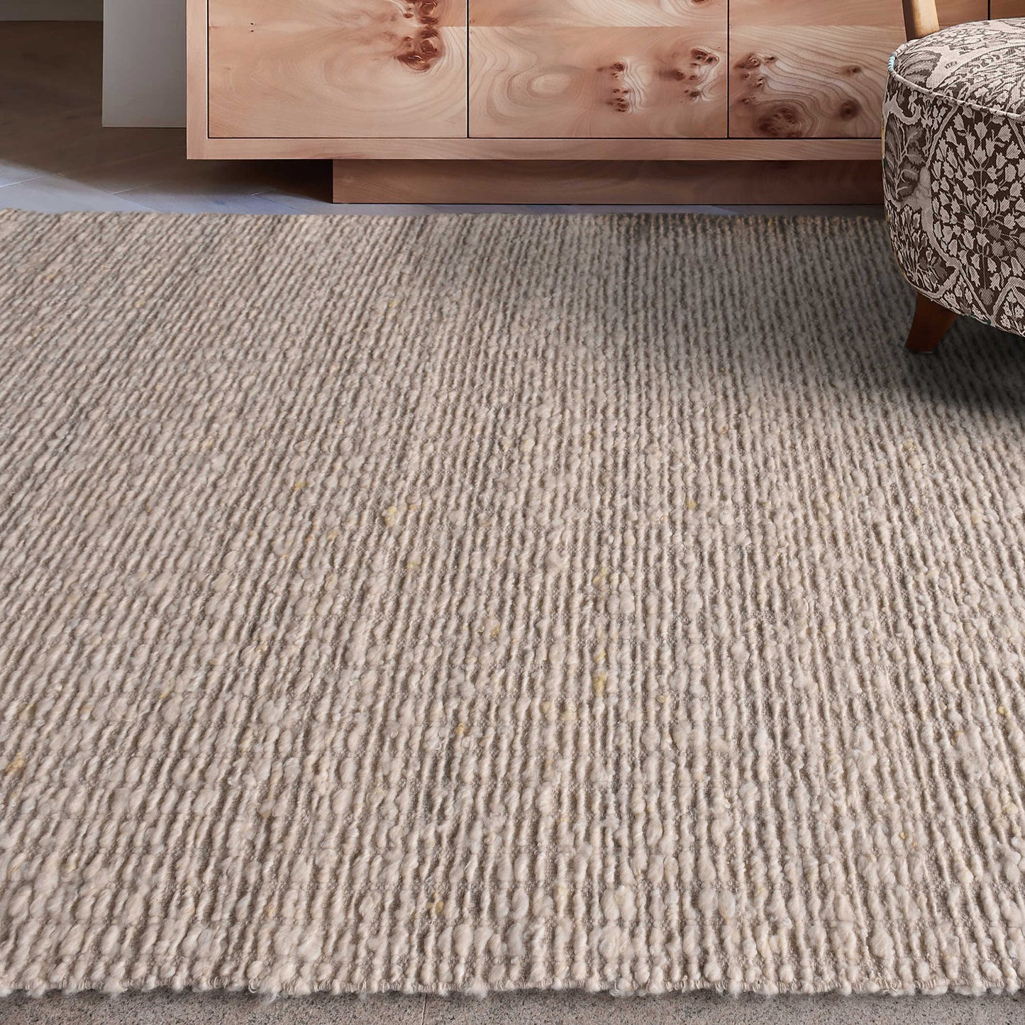 Ivory area rug in living room.