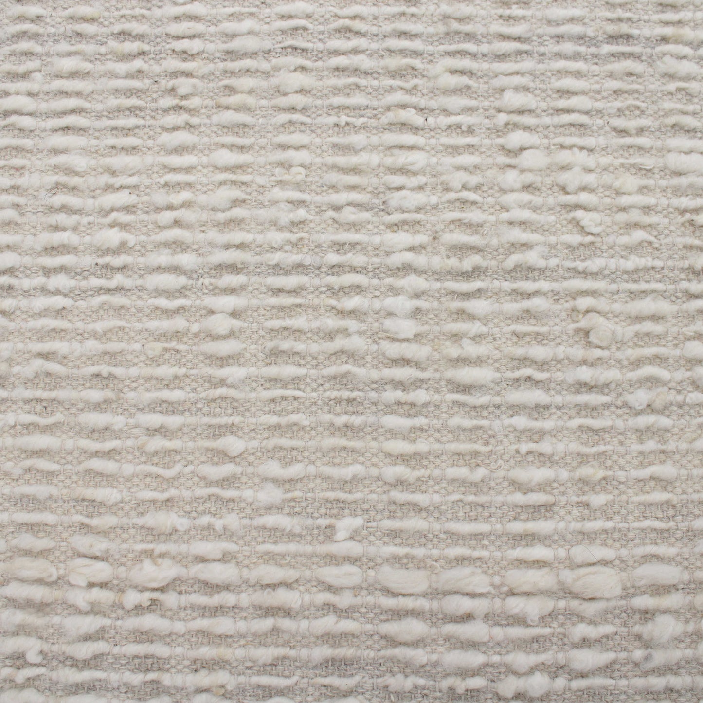 Ivory area wool rug.