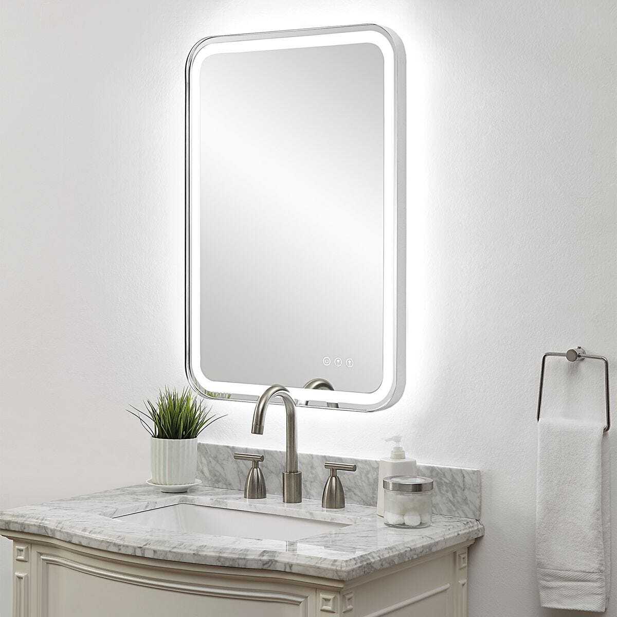 Light up polished nickel bathroom vanity mirror angled.
