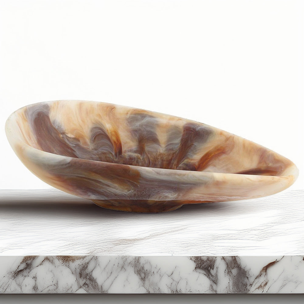 Marbleized bowl on white kitchen counter.