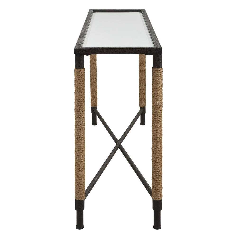 Small table with glass top and woven legs on a white background