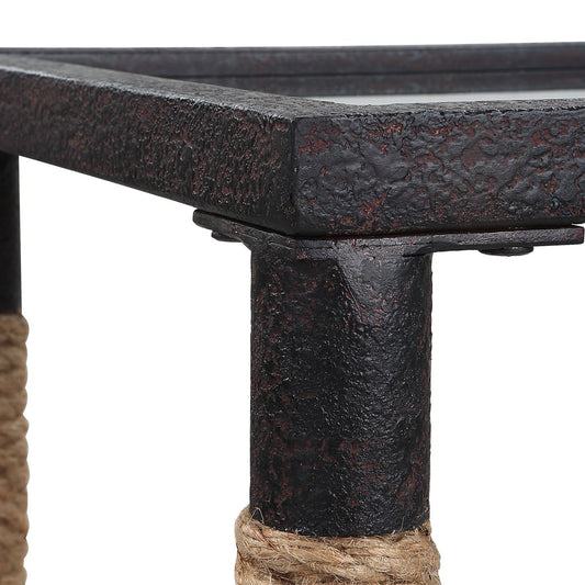 Nautical console table with coral sculpture and white lamp in a living room.