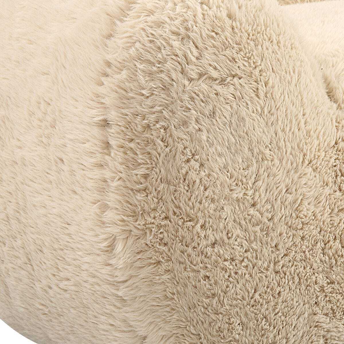 Close-up of a beige fluffy cushion