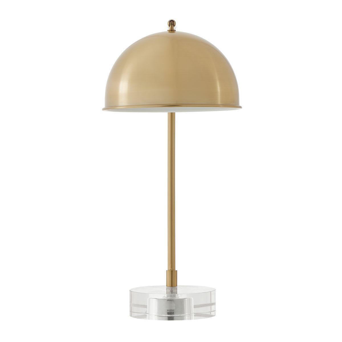 Gold table lamp with a clear base on a white background