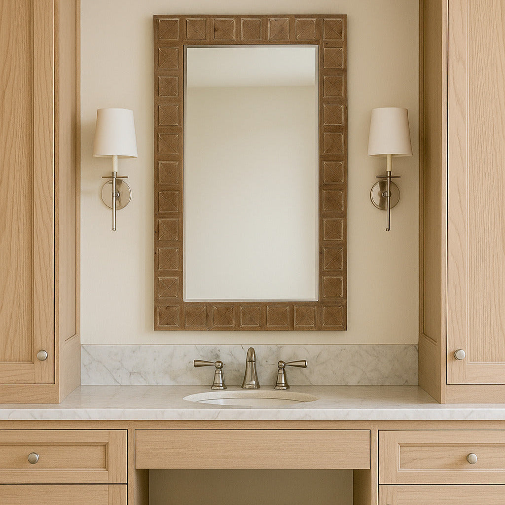 Bathroom vanity with wooden cabinets, mirror, and stool.