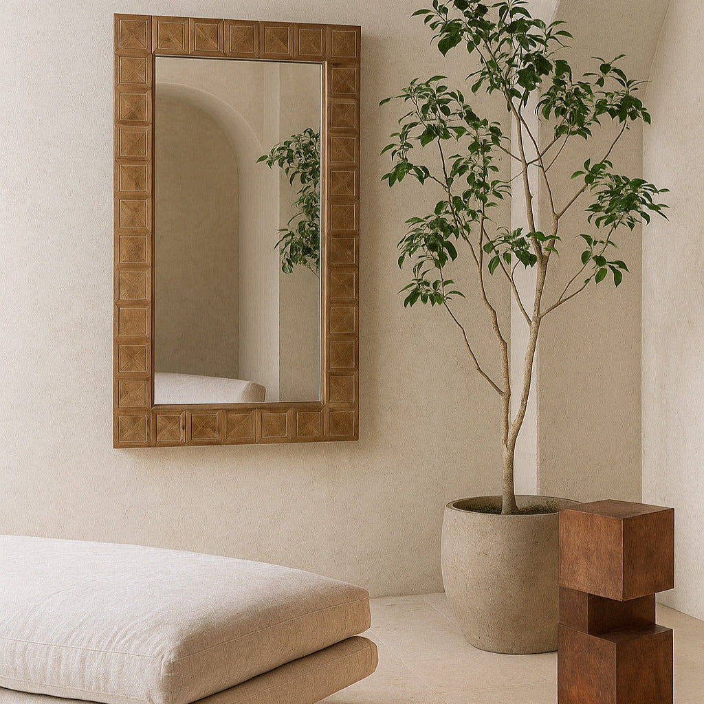 Modern interior with a mirror, plant, and textured wall.