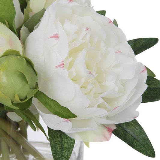Fake peony flowers on black console.
