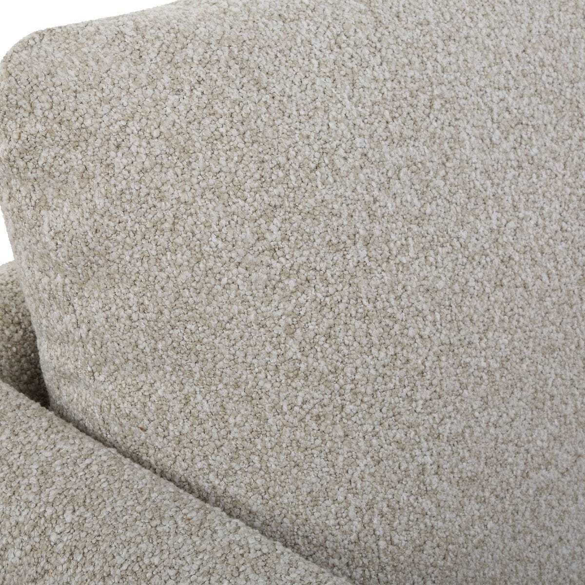 Close-up of textured beige fabric with a slight pattern