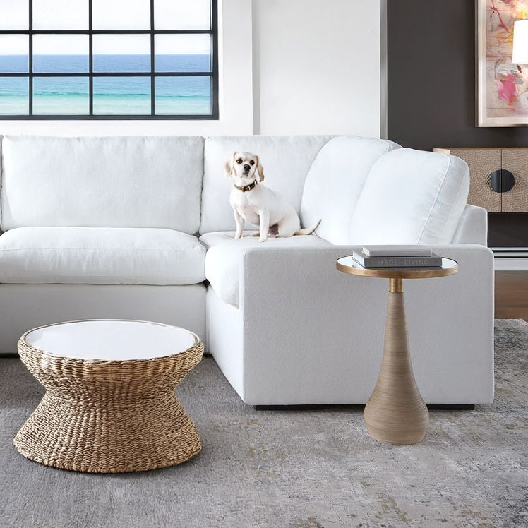 White sofa with rattan decorative table.