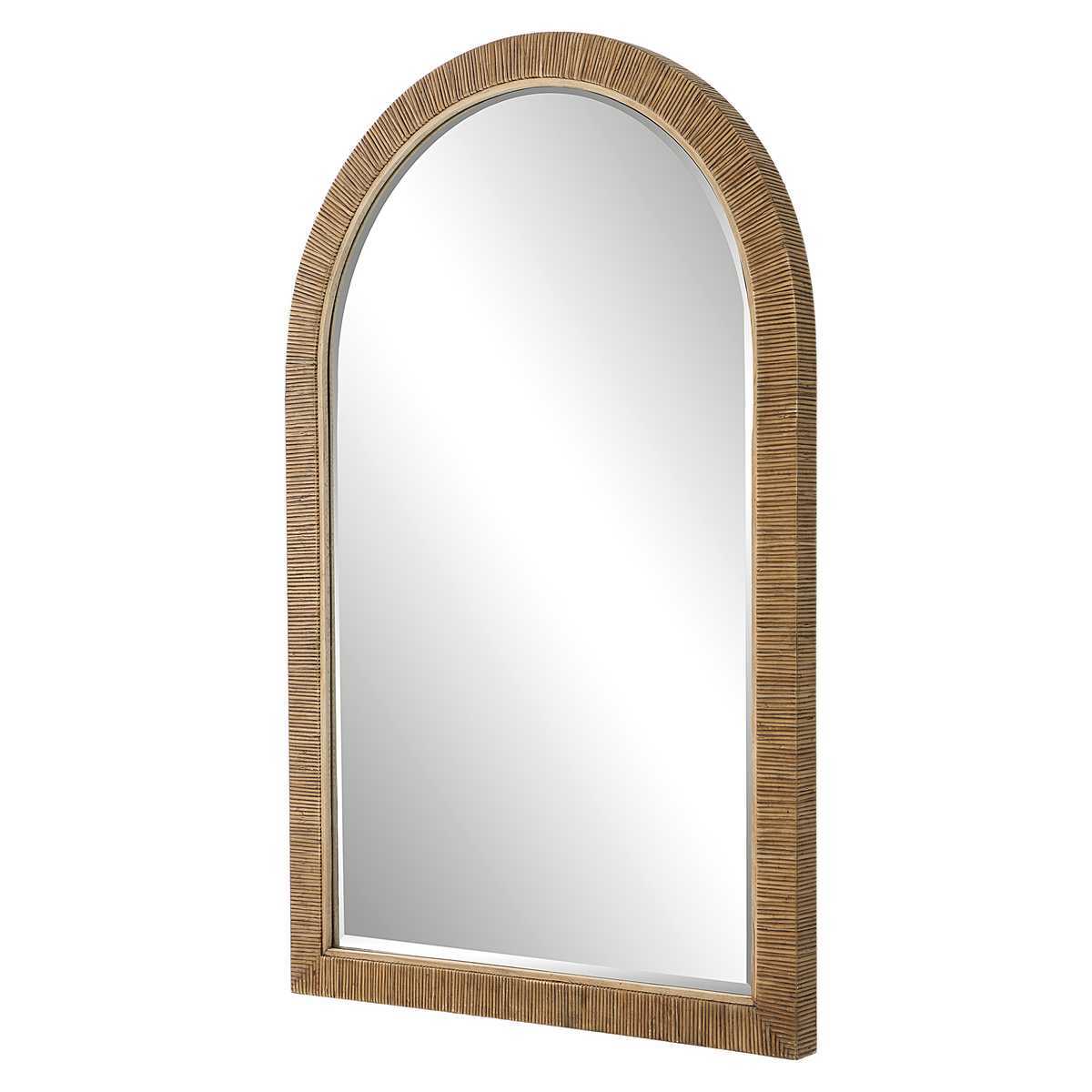 Arch-shaped mirror with rattan frame on a white background