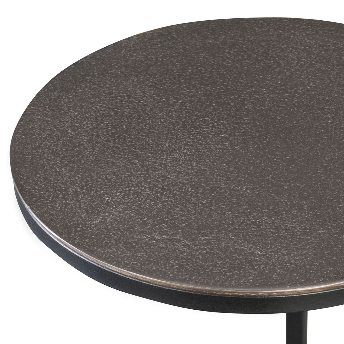 Round table with a dark gray surface on a white background