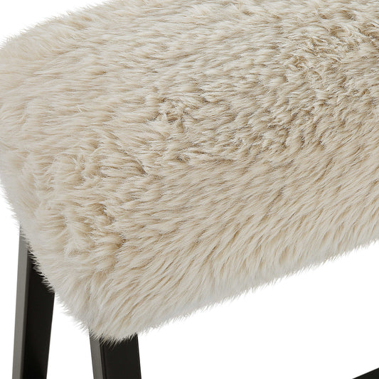 White sherpa bench in wabi sabi living room with tan rug.