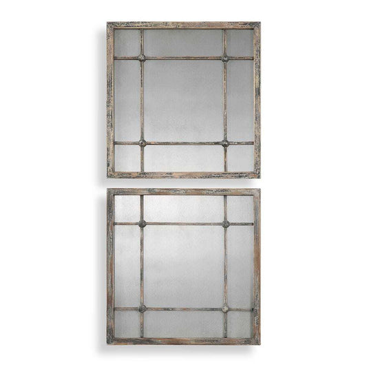Two rectangular mirrors with decorative frames on a white wall.
