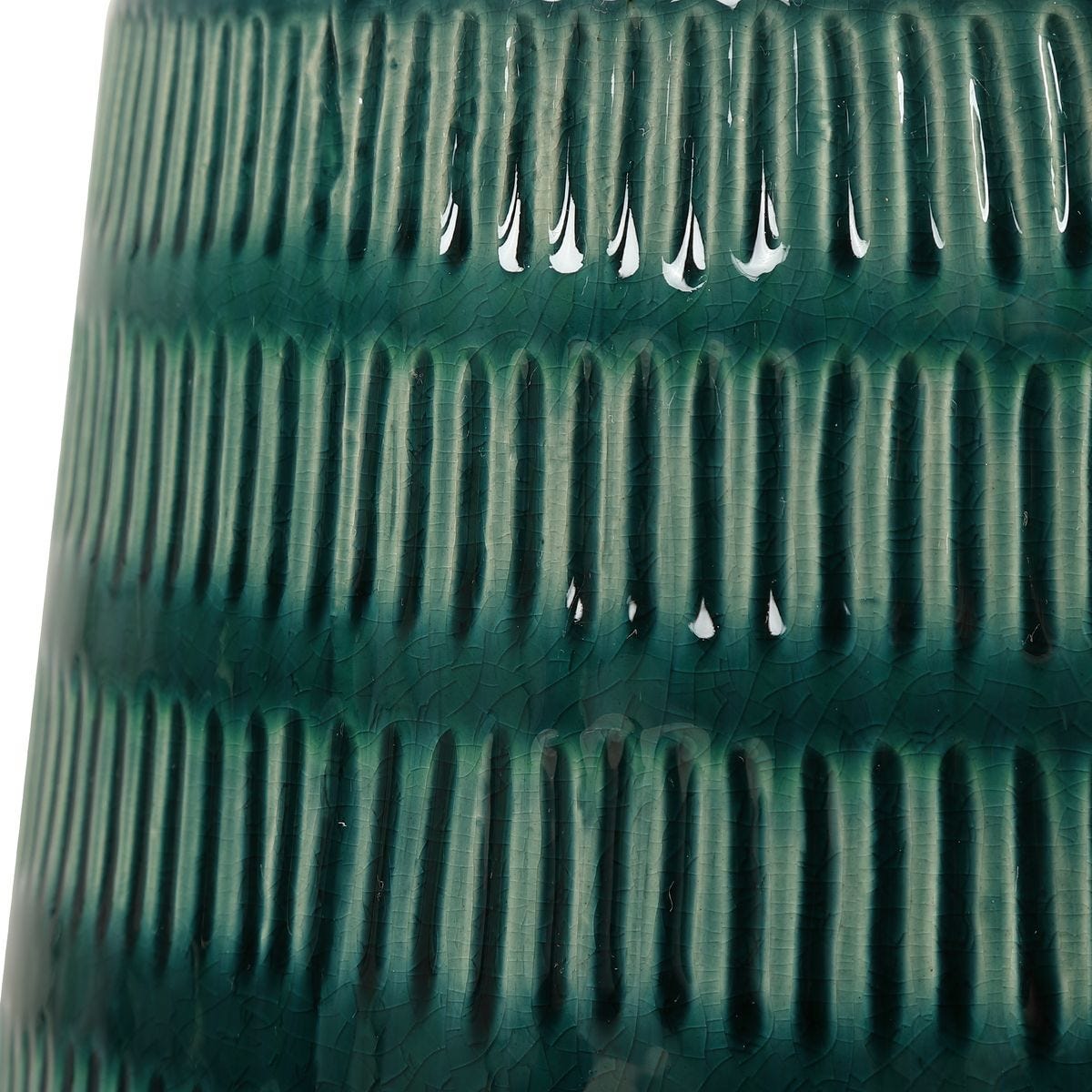 Close-up of a green textured vase on a white background
