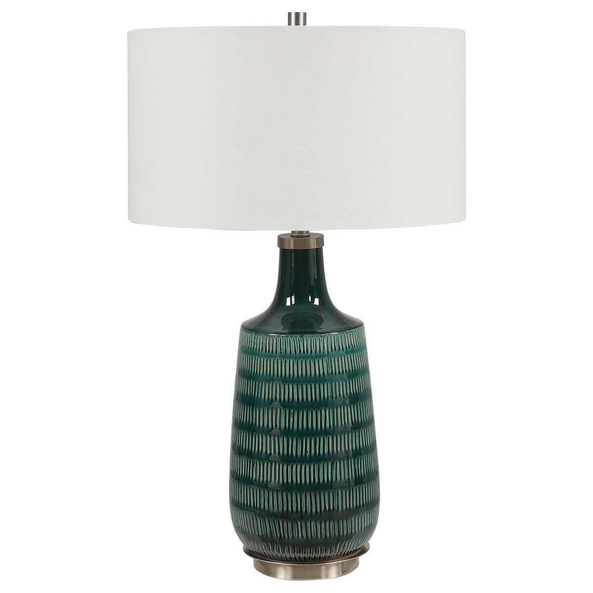 Table lamp with textured green base and white shade on a white background