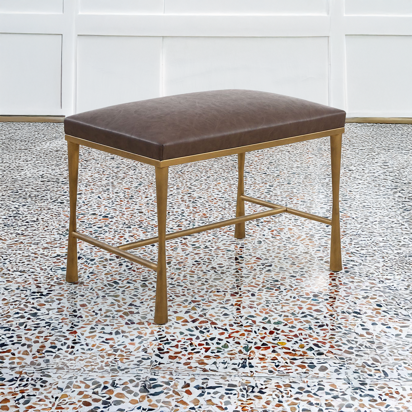 Small Leather Bench on Terrazzo Floor.