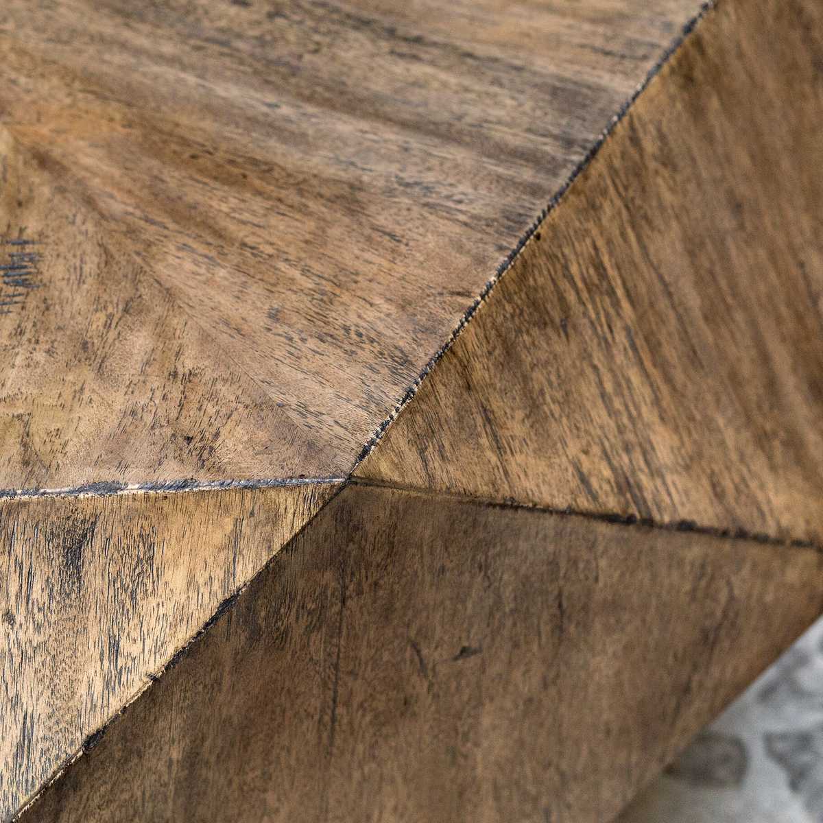 Close-up of a burnished honey wood surface with a geometric pattern