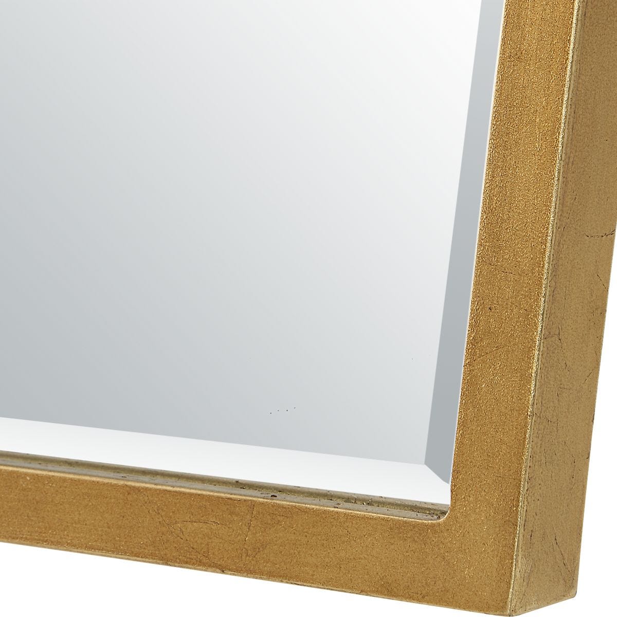 Close-up of a gold rectangular frame corner on a white background