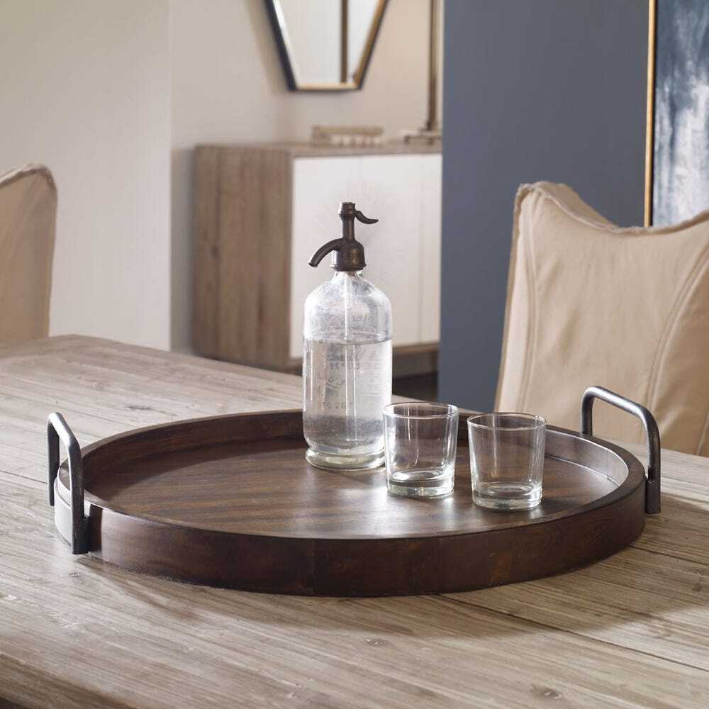 Wooden tray with a bottle and glasses on a wooden table