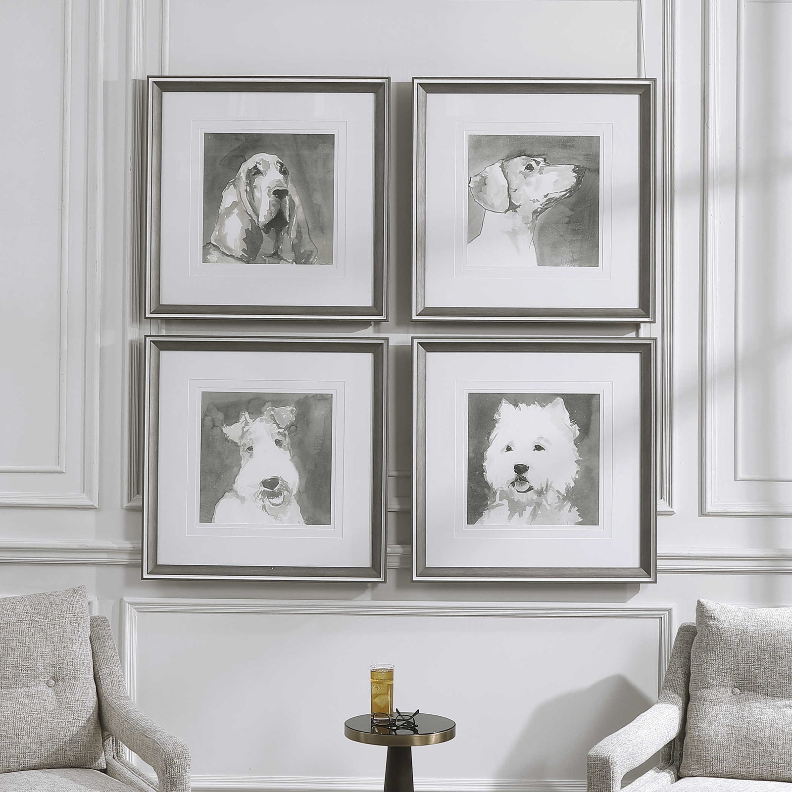 Straight on view of set of 4 dogs on a white wall with an accent table and drink in front.