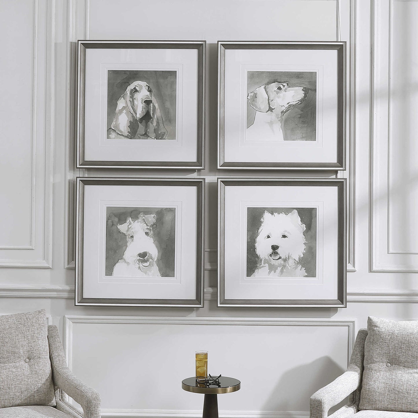 Straight on view of set of 4 dogs on a white wall with an accent table and drink in front.